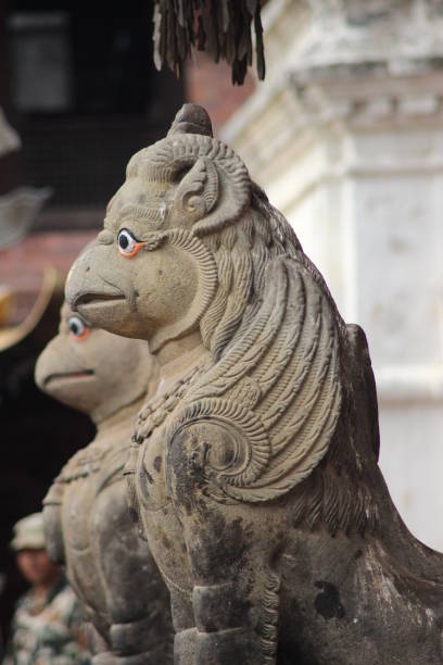 Two statue of an mystic animal a mix of bird and lion believed being the guard for a temple. It placed below the stairwell as totem guard of the monastery