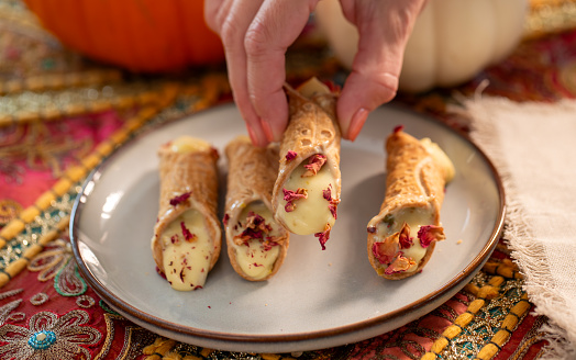 Custard filled dessert with rose flakes