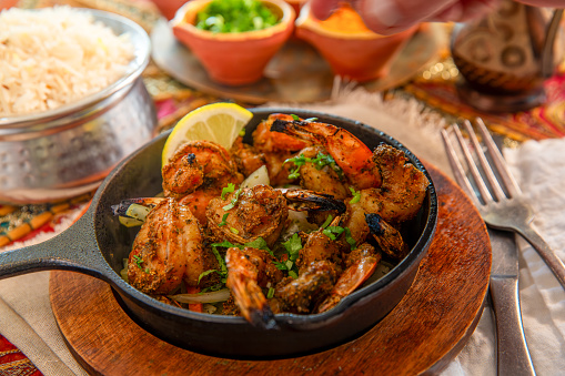 Jumbo shrimp seasoned with herbs & spices, then grilled in tandoor clay oven