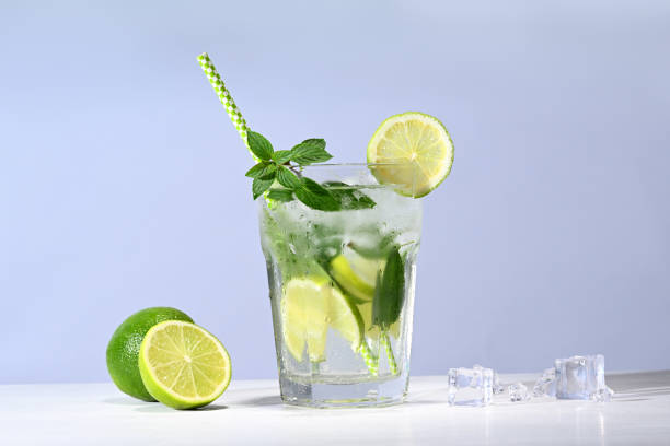 istock Glass with mojito cocktail and limes 2043782901