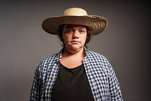 Studio portrait of a serious female farm worker