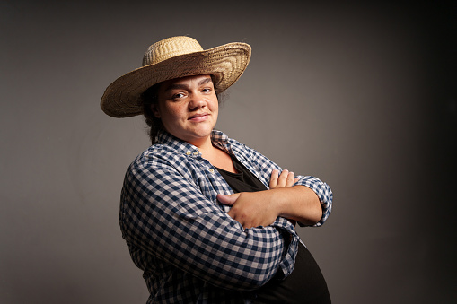 Studio portrait of a happy female farm worker