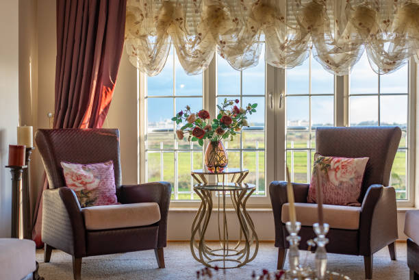 The dining room in classical style, light furniture, marble, luxury.