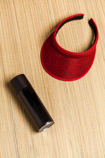 istock Beach mat black spray can and a visor on blue background 2043853568