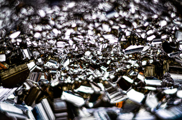 Native bismuth on white chondrodite. Micro photography extreme close-up. Specimen from Conchita Mine, Spain. microscope photography for Scientific use.