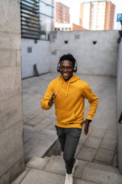 istock African athlete running up stairs during his cardio workout 2043943556