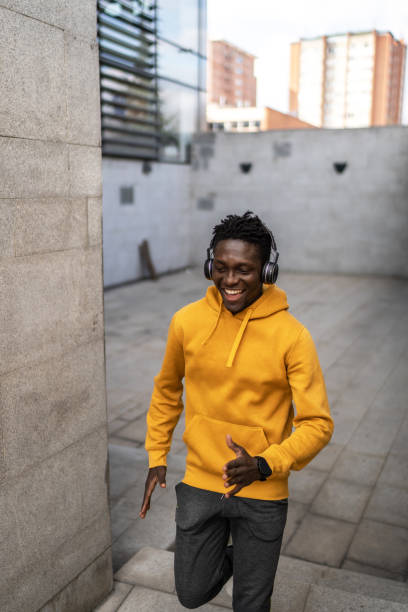 istock African athlete running up stairs during his cardio workout 2043944082