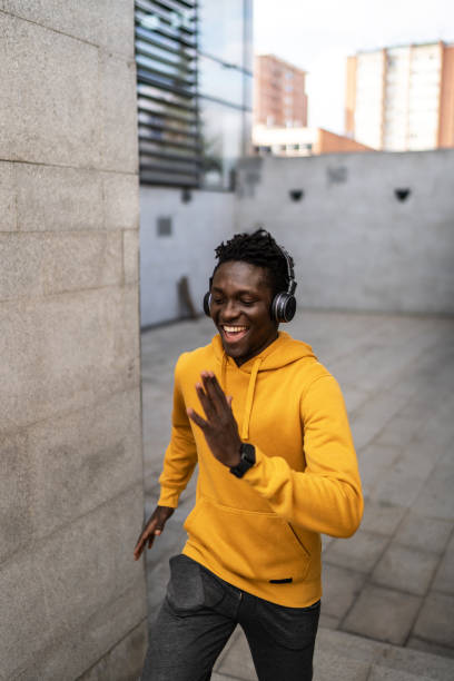 istock Black athletic man running up and down the stairs 2043945107