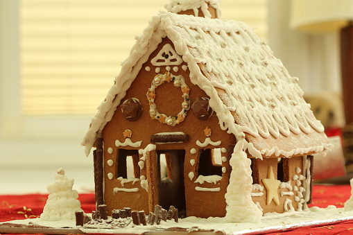 Gingerbread house decorated with icing, sweets and chocolates