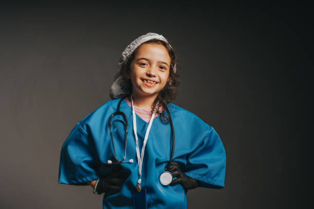 Little girl playing dressed as a doctor