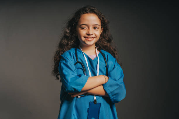 istock Little girl playing dressed as a doctor 2043967632
