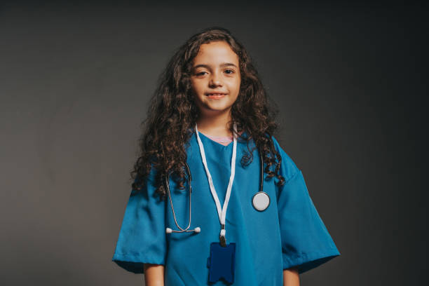 istock Little girl dressed as a doctor to play 2043967633