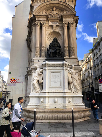 Paris, France: The elegant Fontaine Moliere in the 1st arrondissement; the statue was put into place in 1844 and celebrates the famous 17th century playwright.