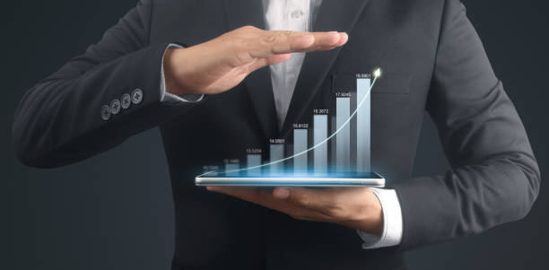 istock Businessman plan graph growth and increase of chart positive indicators,tablet in hand 2043981709