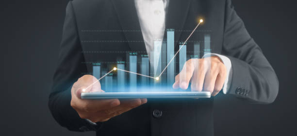 istock Businessman plan graph growth and increase of chart positive indicators,tablet in hand 2043982124