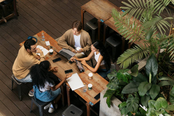 istock College friends studying together at coffee shop 2044005514