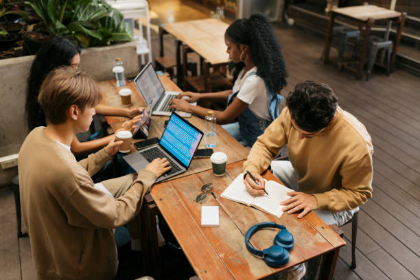 istock Multiracial group of young students studying in cafe 2044007568