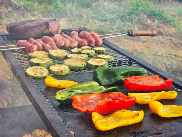 Green, red and yellow peppers, zucchini, a skewer with sausage and a picanha