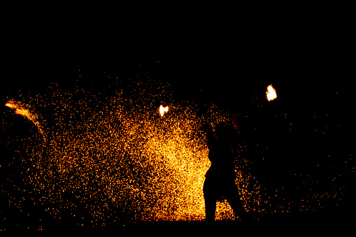 fire in dark. luminous lines of sparks. explosion black powder.