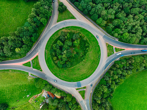 Drone top down view of a busy English roundabout seen in Keswick