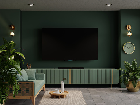 Green wall mounted tv on cabinet in living room with green sofa and decor accessories,minimal design- 3D rendering