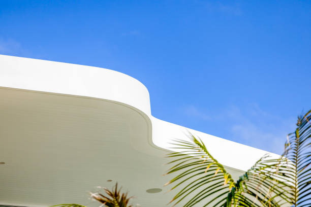 Closeup top part of modern new house, background with copy space, full frame horizontal composition