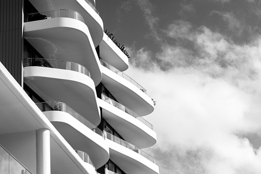Black and white closeup new, modern apartment building, Cronulla Australia, background with copy space, full frame horizontal composition