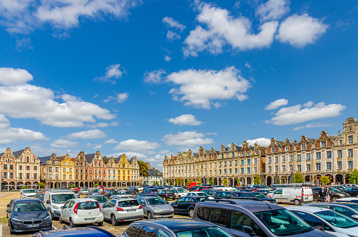 Arras, France, July 3, 2023: Flemish-Baroque-style townhouses on La Grand Place square in historical city center, blue sky in summer day, Artois, Pas-de-Calais department, Hauts-de-France Region