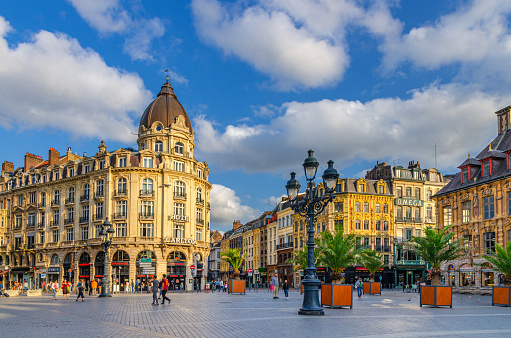 Lille, France, July 3, 2023: Place du Theatre square in Lille city historical center, Hotel Carlton, Vieille Bourse, street light and trees, French Flanders, Nord department, Hauts-de-France Region