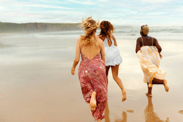 istock multiracial group of friends strolling on the beach 2044240550