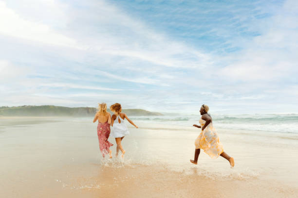 istock young women enjoying a day at the beach 2044241070
