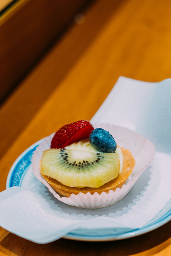 Delicious Fruit Tart with Kiwi, Strawberry, and Blueberry at a Sweet Shop in Venice, Italy