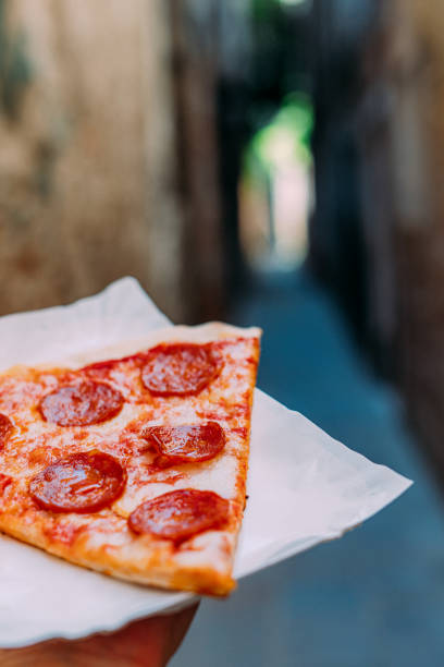 istock Slice of Pizza in an Alley with Copy Space 2044323992