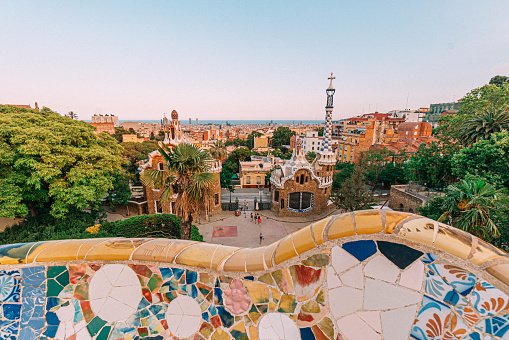 Artistic Bench with Vibrant-Colored Ceramic Tiles at Park Guell, Barcelona, Spain on a clear evening