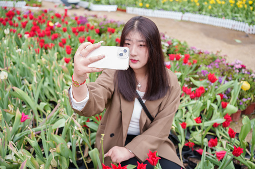 Girl taking selfie with smartphone