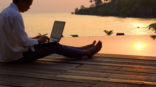 istock Busy freelance man with laptop outdoor. 2044424281
