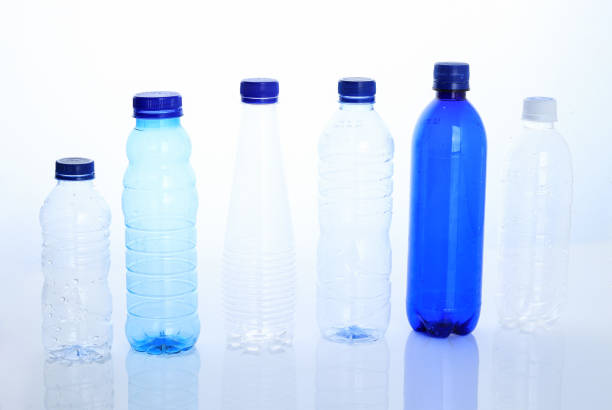 Plastic bottles on a white background as a symbol of ecological catastrophes. Empty bottles from water as an advertisement for recycling.