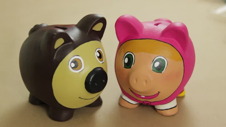 Piggy banks designed with inspiration from characters of Masha and the Bear