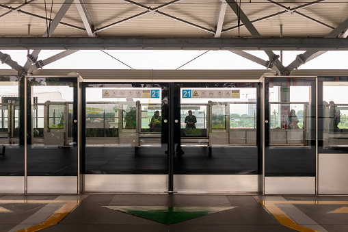 Jakarta, Indonesia - February 24, 2024: View of Platform Screen Door (PSD) or Platform Edge Door (PED) at Jakarta MRT train Lebak Bulus station