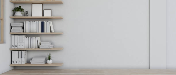 A front view of a modern empty room features a white wall, parquet floor, and wall bookshelves.