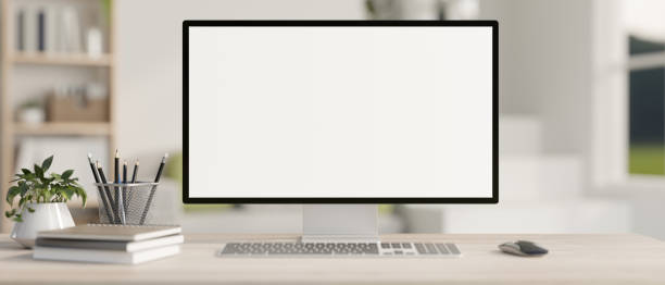 istock A computer desk in a contemporary home office features a white-screen computer mockup. 2044461305