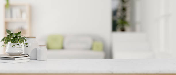 istock A presentation space on a white tabletop with a blurred background of a contemporary living room. 2044466566