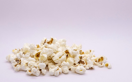 Popcorn in Heap Isolated on White Background with Copy Space.