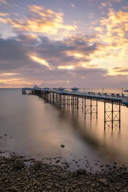 Photo of Sunrise golden light over Llandudno Pier in the Victorian seaside resort in North Wales