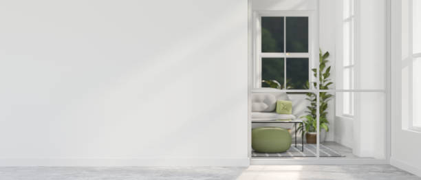 istock A modern home corridor in front of a living room features a white wall. 2044499276