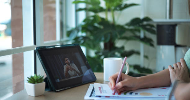 istock Two young women learning financial investing through internet on tablet 2044519997