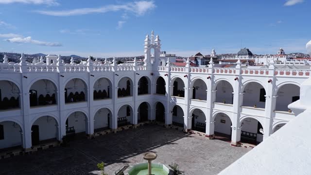 Pan across interior courtyard of San Felipe de Neri convent in Bolivia