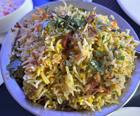 A plate of chicken biriyani kept on the table