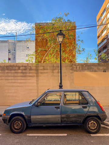 Old vintage car parked in the street in the city of Valencia, Spain