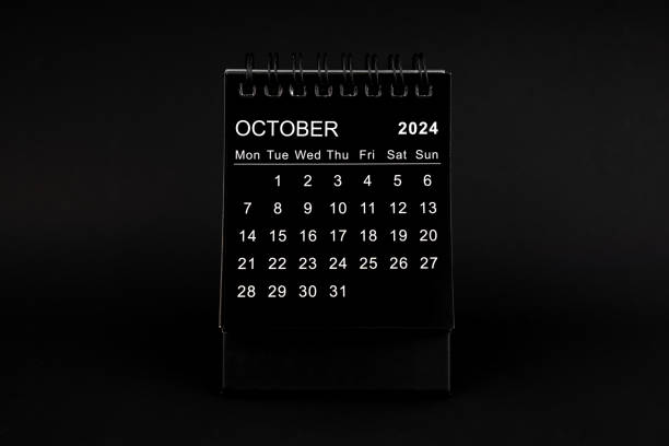 istock Black Calendar for October 2024. Desktop calendar on a black background. 2044607303